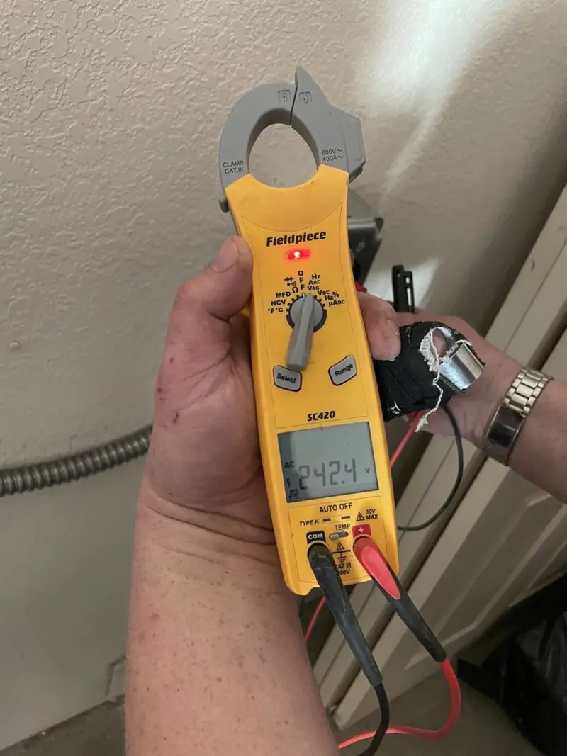 Voltage testing with clamp meter during Recessed Lighting Installation in Wiscasset